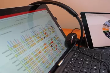 Multiple tablet computers showing data and graphs